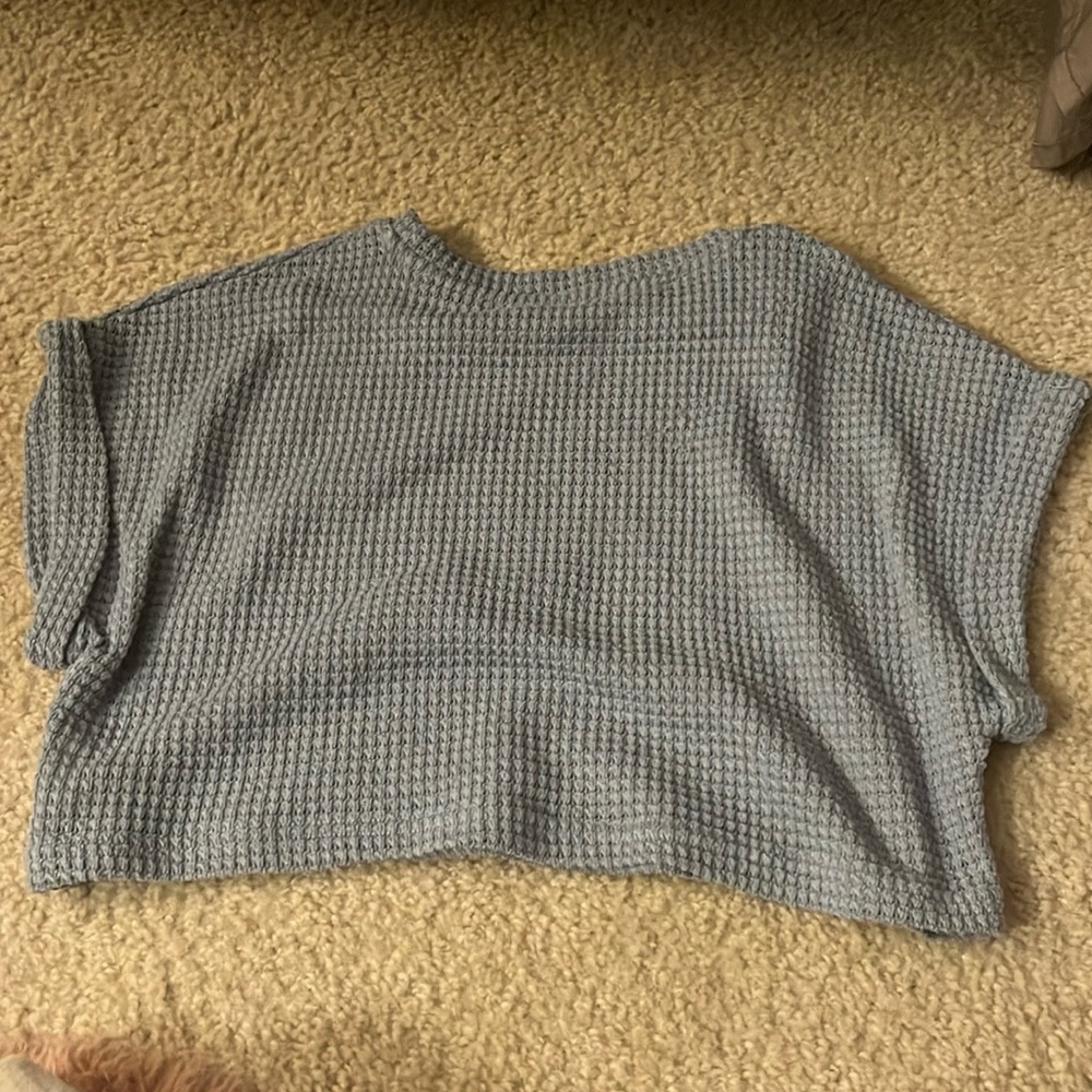 This is a blue netted crop top